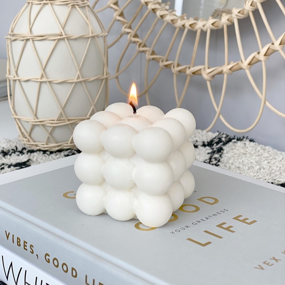 Large white bubble candle and white scallop seashell candle